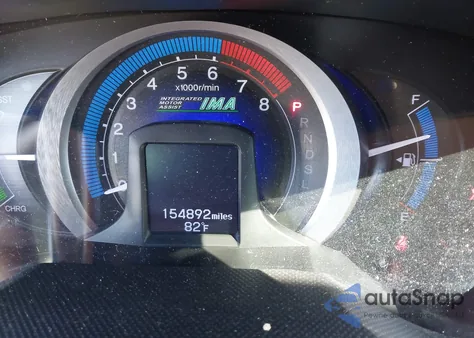 2011 Honda Insight from USA, damaged, VIN JHMZE2H3XBS005408